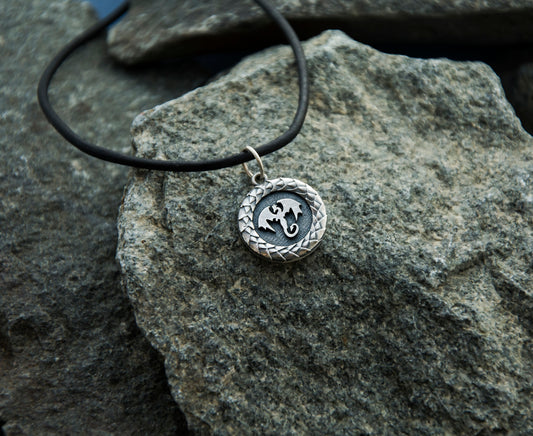 Sterling silver round pendant with dragon design