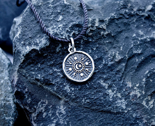 Sterling silver pendant with moon phases design