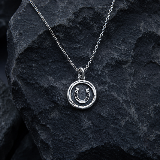 Sterling silver pendant with horseshoe design