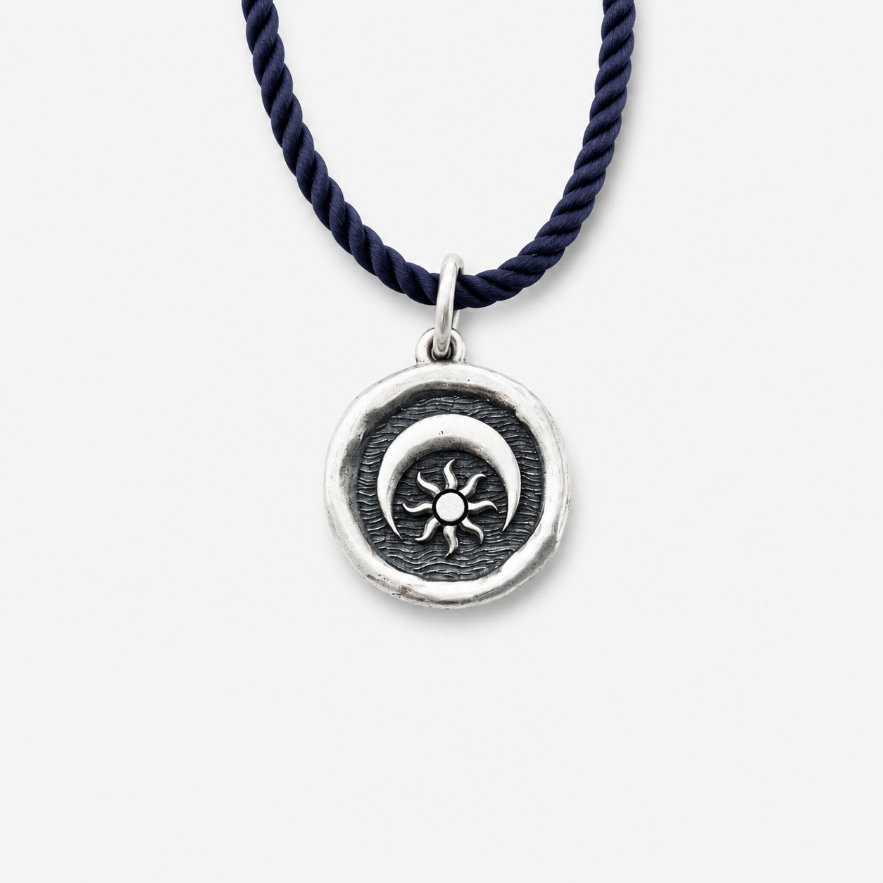 Sterling silver pendant with sun and moon design