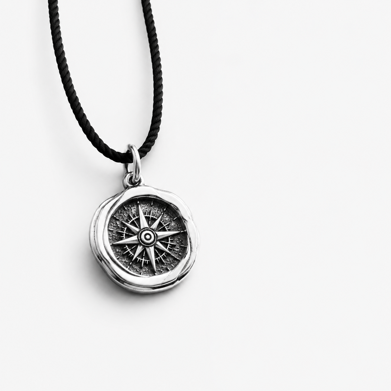 Sterling silver pendant with compass design