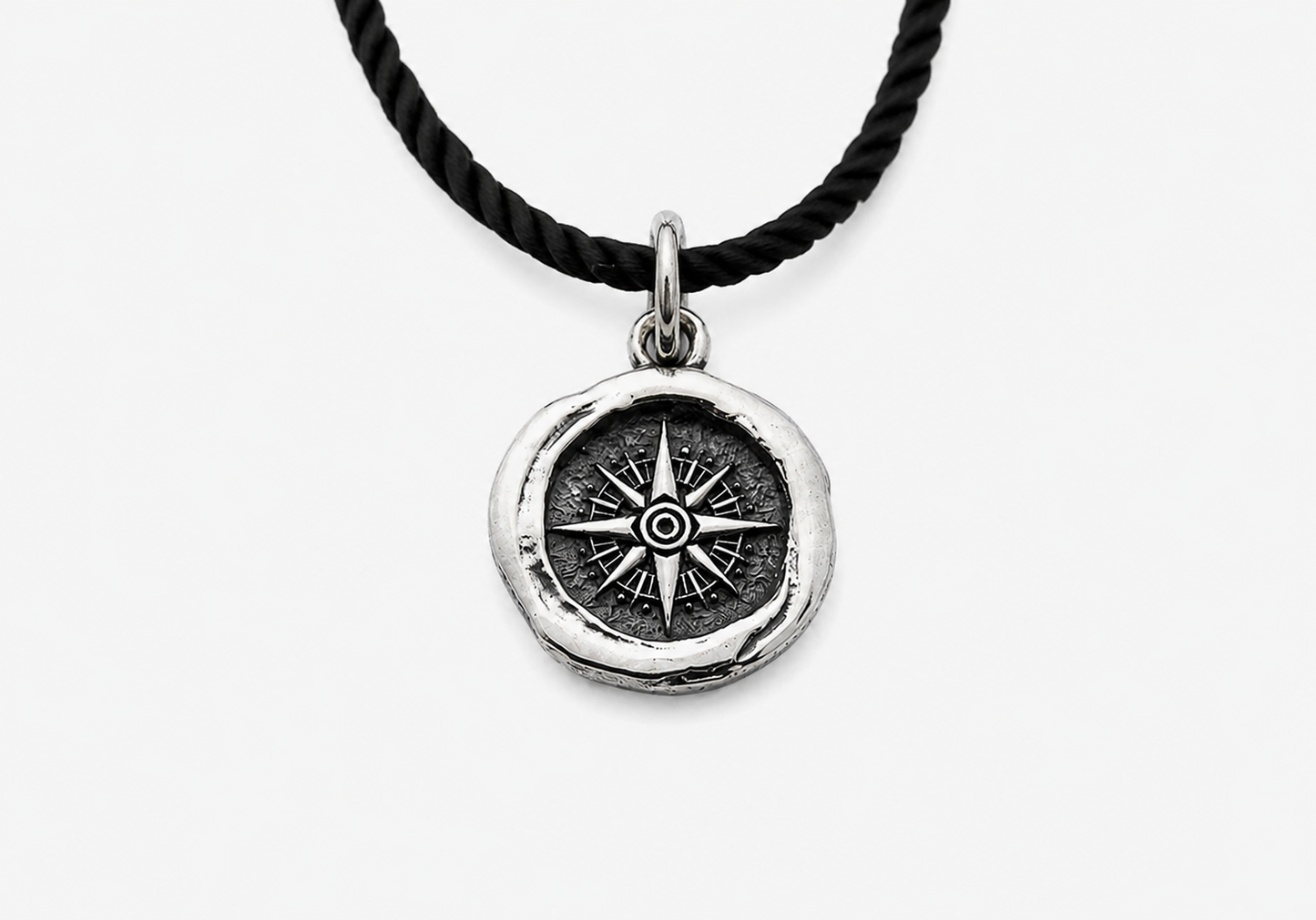 Sterling silver pendant with compass design