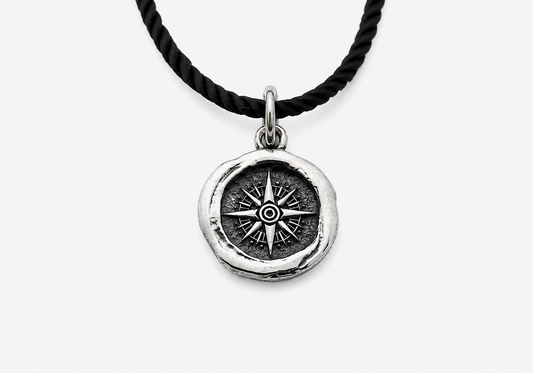 Sterling silver pendant with compass design