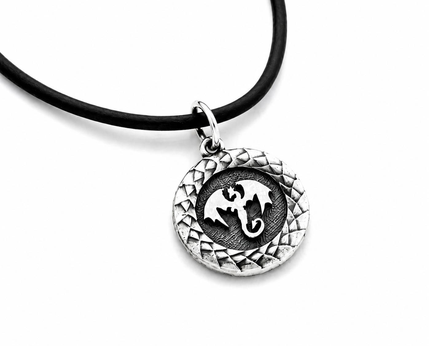 Sterling silver round pendant with dragon design