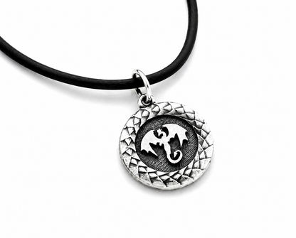 Sterling silver round pendant with dragon design
