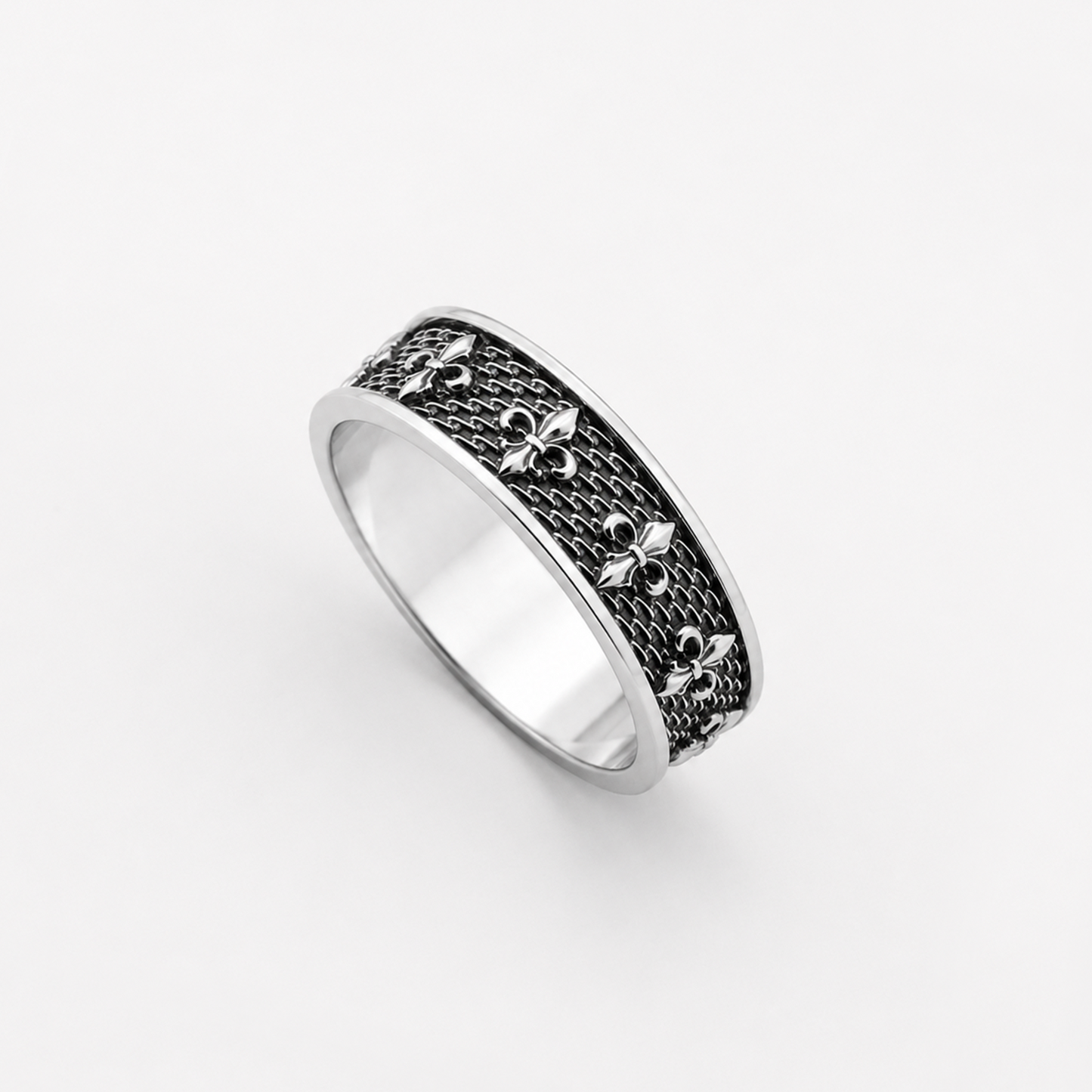 Sterling silver ring with fleur-de-lis pattern and oxidized details