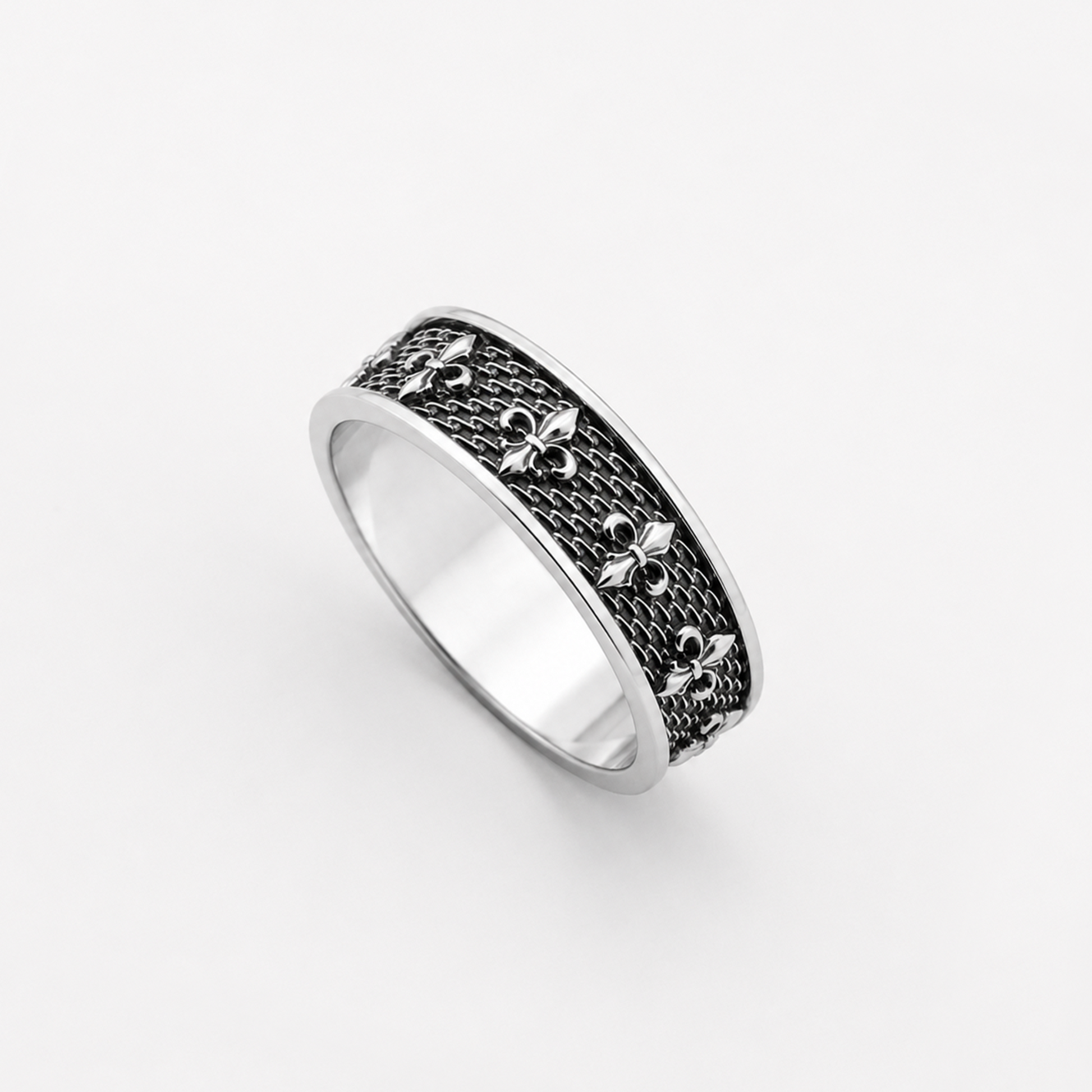 Sterling silver ring with fleur-de-lis pattern and oxidized details