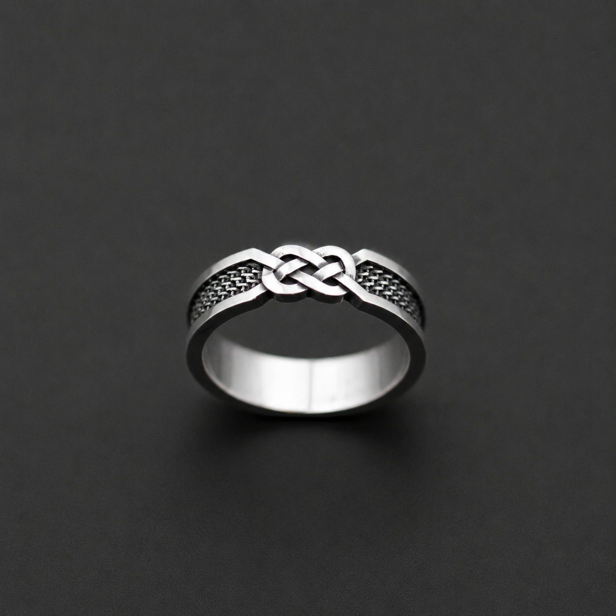 Sterling silver ring with infinity knot design