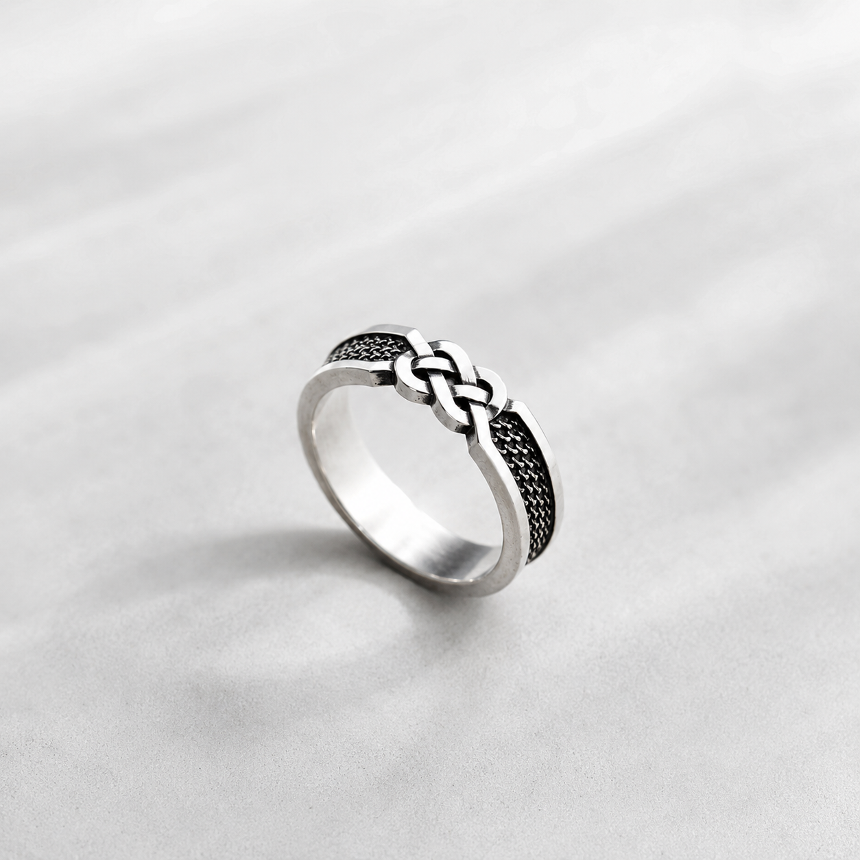 Sterling silver ring with infinity knot design