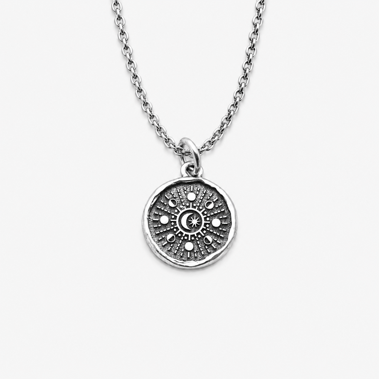 Sterling silver pendant with moon phases design
