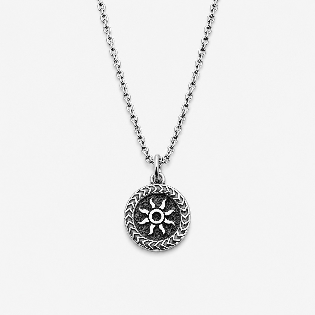 Sterling silver pendant with sun design