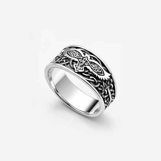 Sterling silver ring featuring a raven motif and Celtic ornament