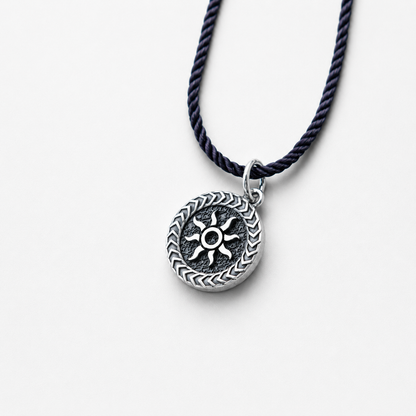 Sterling silver pendant with sun design