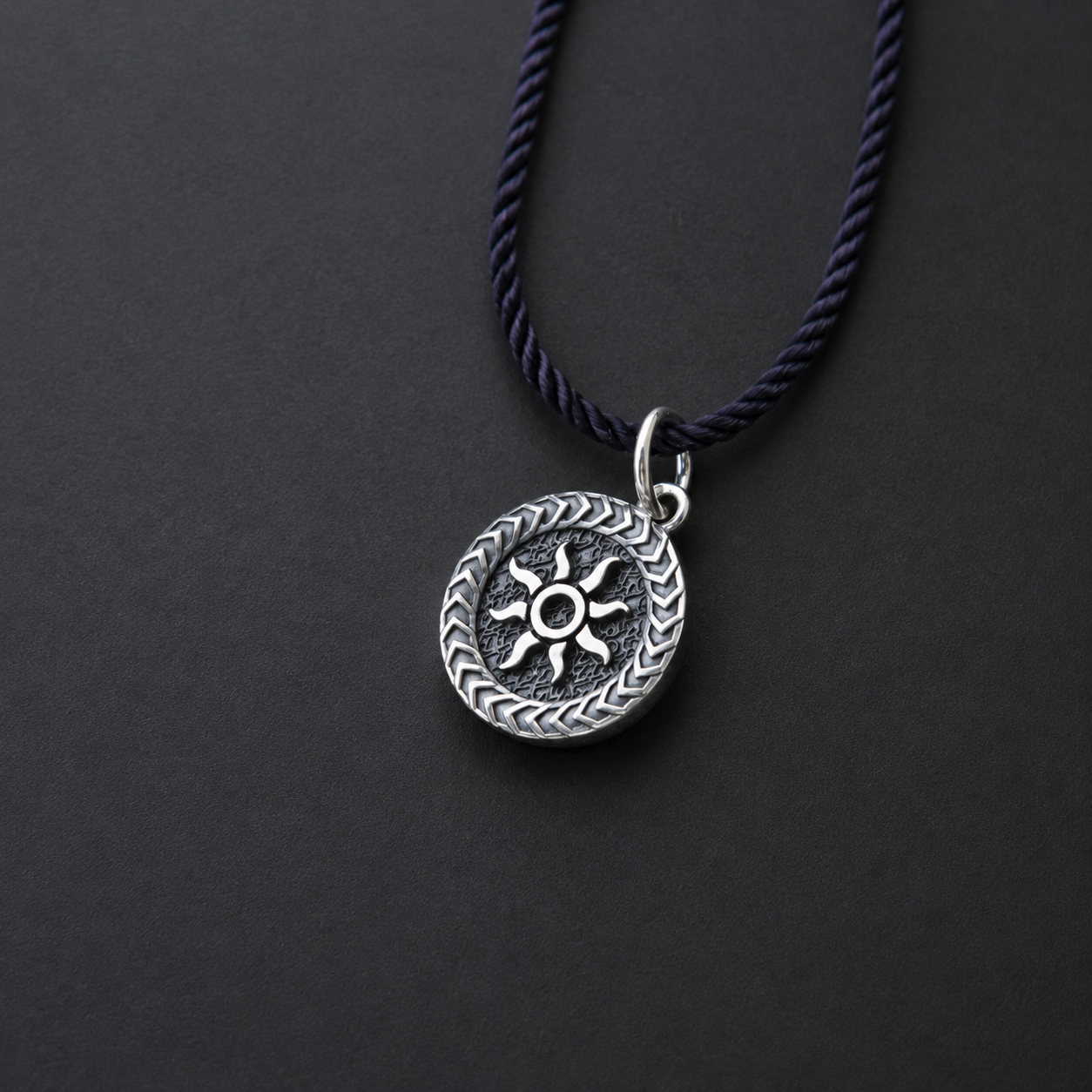 Sterling silver pendant with sun design