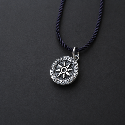 Sterling silver pendant with sun design