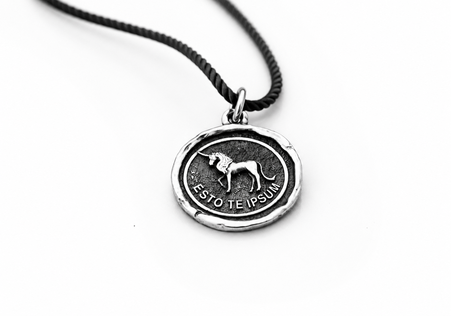 Sterling silver pendant with unicorn design and Esto Te Ipsum inscription